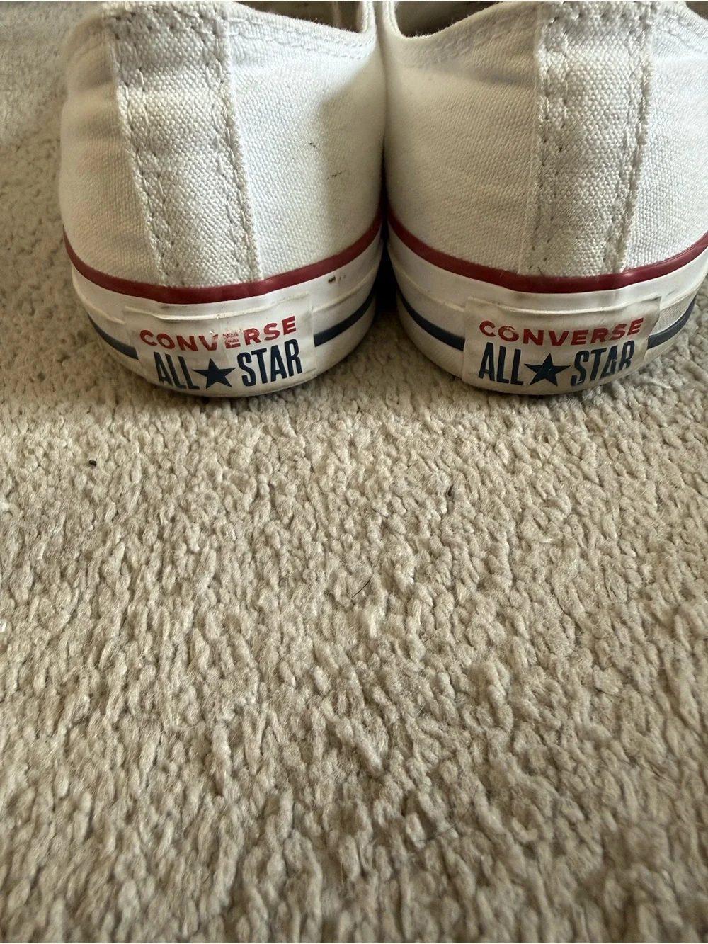 Converse Low Top Sneakers in White with Red Trim